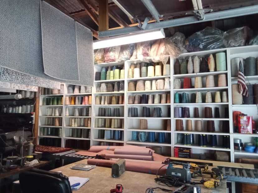 Carolina Custom Carpets binding studio workshop with professional carpet binding equipment and materials